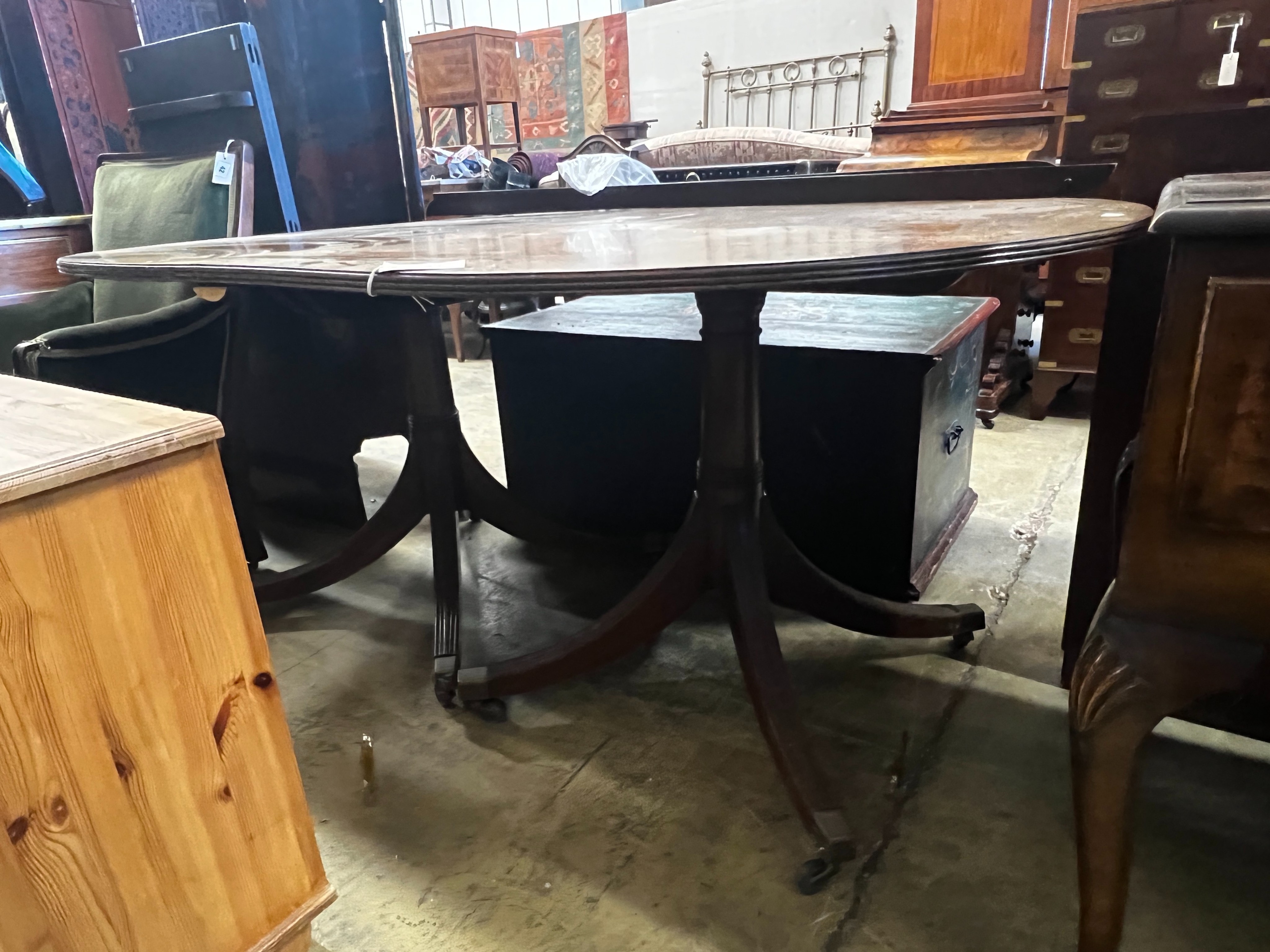 A George III style mahogany twin pedestal D end extending dining table, length 158cm, 248cm extended, two spare leaves, width 110cm, height 72cm